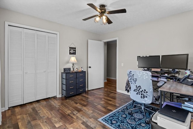 office with a textured ceiling, baseboards, ceiling fan, and wood finished floors