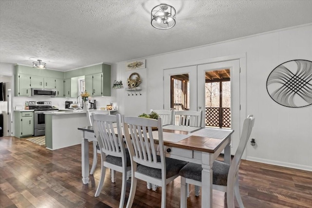 dining room with french doors, a textured ceiling, and dark wood finished floors