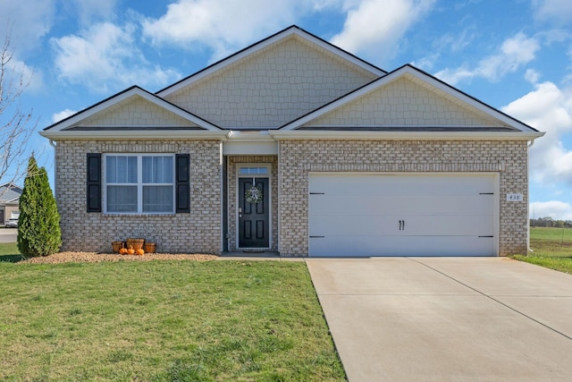 view of front of property featuring a front yard, brick siding, a garage, and driveway