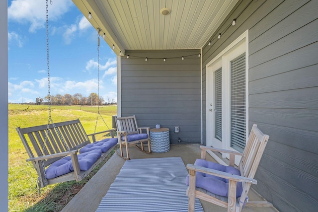 wooden deck featuring a lawn