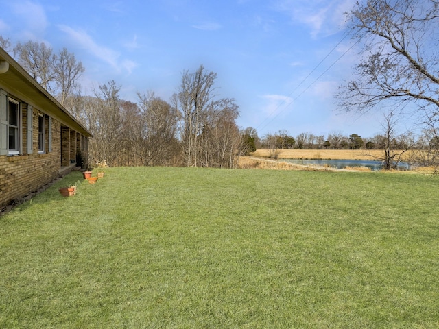 view of yard with a water view