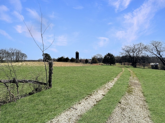 view of yard with a rural view