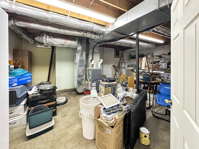 unfinished basement featuring heating unit