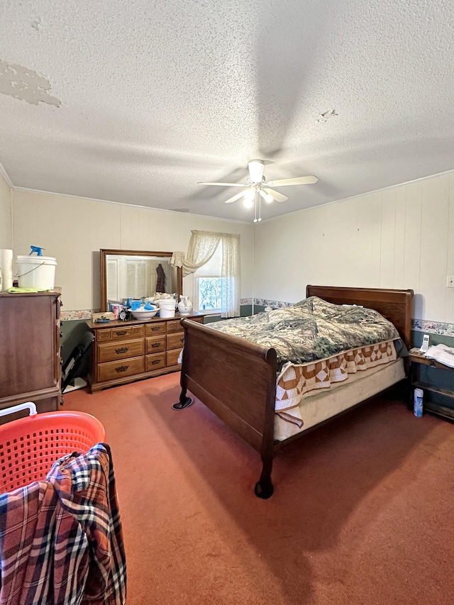 bedroom featuring carpet floors, a textured ceiling, and ceiling fan