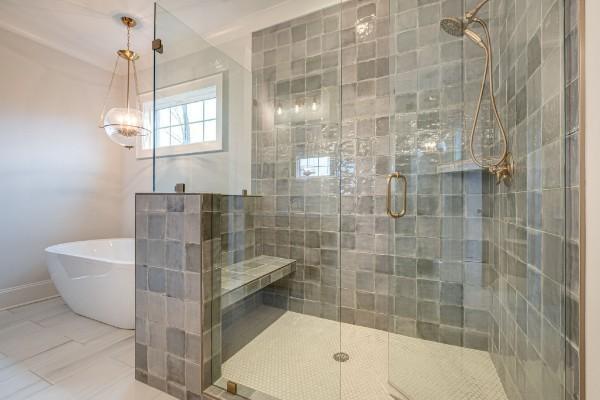 bathroom featuring a freestanding bath and a stall shower