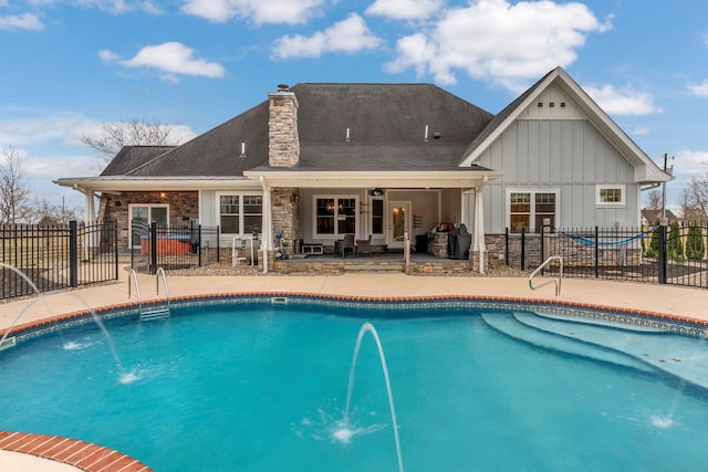 view of swimming pool featuring a fenced in pool, a patio, and fence