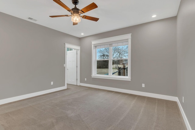 carpeted spare room with recessed lighting, visible vents, and baseboards