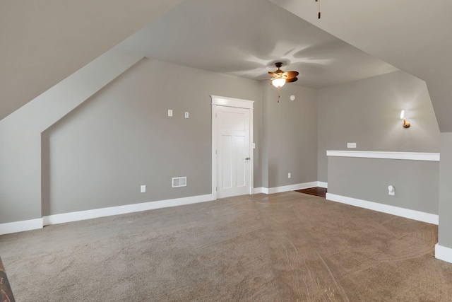 additional living space with a ceiling fan, carpet, visible vents, and baseboards