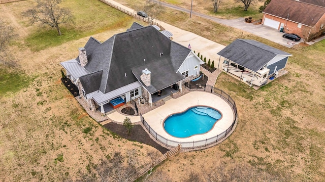 view of swimming pool with a patio area, a fenced in pool, and fence