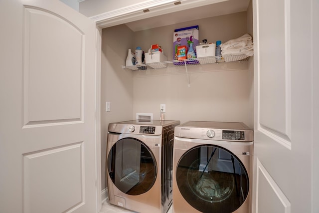 laundry room featuring laundry area and separate washer and dryer