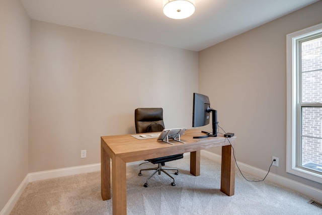 office featuring baseboards and carpet floors