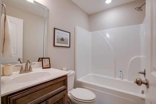 full bathroom with tub / shower combination, toilet, and vanity