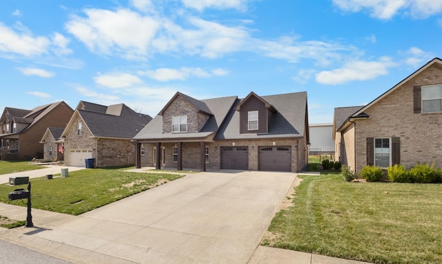 view of front facade with brick siding, a front lawn, an attached garage, and driveway