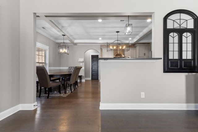 dining room with baseboards, a notable chandelier, dark wood-style flooring, and crown molding