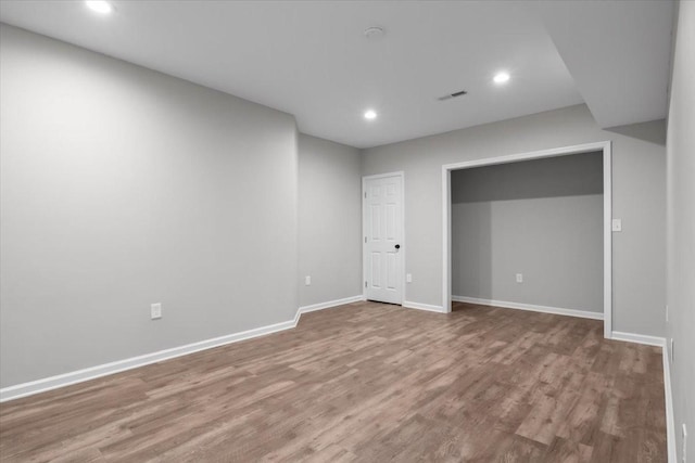 interior space with visible vents, recessed lighting, baseboards, and wood finished floors