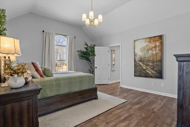 bedroom with baseboards, wood finished floors, and vaulted ceiling