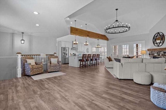 living area featuring recessed lighting, a chandelier, high vaulted ceiling, and wood finished floors