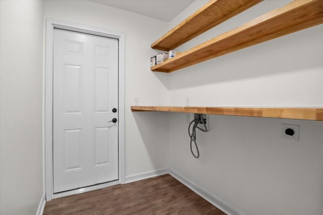 washroom with dark wood-type flooring, washer hookup, baseboards, hookup for an electric dryer, and laundry area