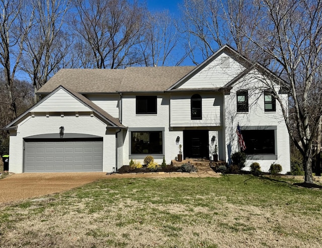 view of front of property featuring a front yard, driveway, roof with shingles, a garage, and brick siding