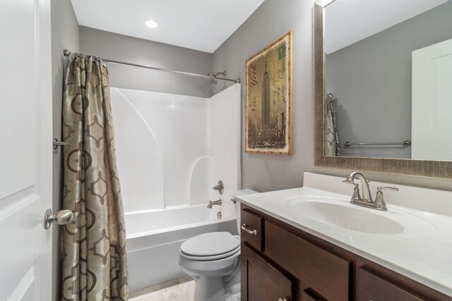 full bath featuring vanity, shower / tub combo, and toilet