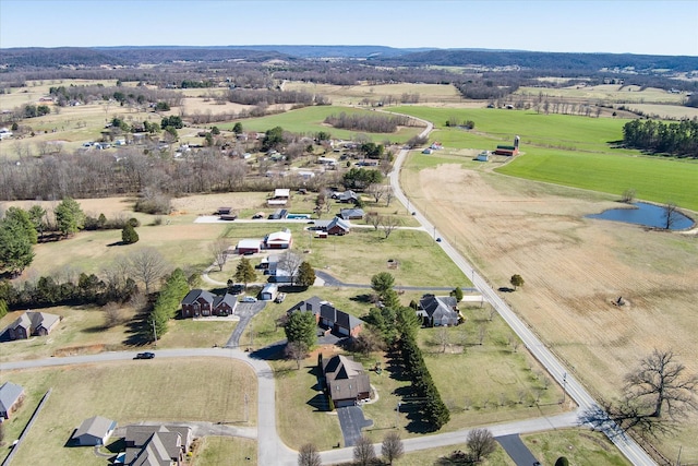 aerial view with a water view and a rural view