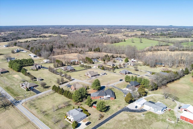 birds eye view of property with a rural view