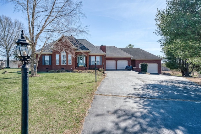 view of front of home with brick siding, a front yard, a garage, crawl space, and driveway