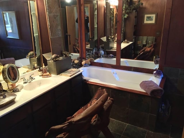 full bath featuring vanity and a bath