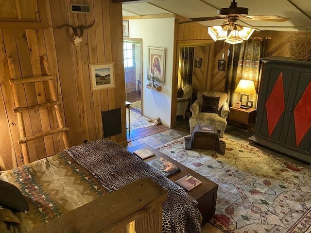 interior space with wooden walls and visible vents