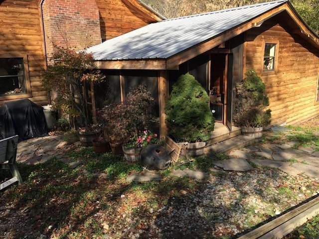 exterior space featuring a sunroom