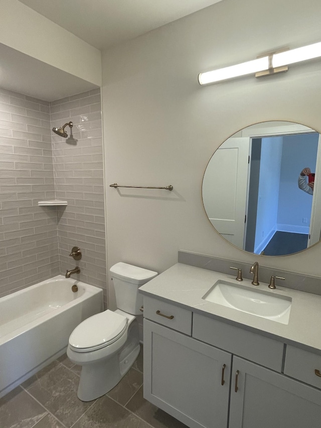 full bath featuring toilet, bathtub / shower combination, and vanity