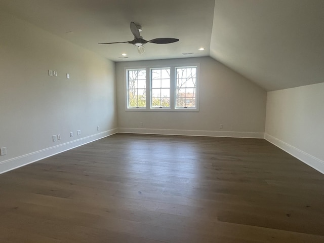 additional living space featuring ceiling fan, baseboards, vaulted ceiling, recessed lighting, and dark wood-style floors