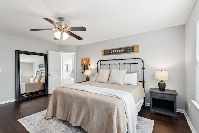 bedroom featuring connected bathroom, baseboards, hardwood / wood-style floors, and a ceiling fan