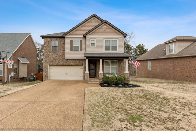 craftsman-style house featuring central air condition unit, covered porch, concrete driveway, a garage, and brick siding