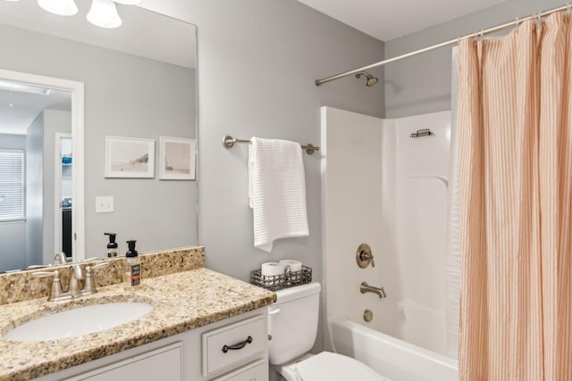 full bath with shower / bath combination with curtain, vanity, and toilet