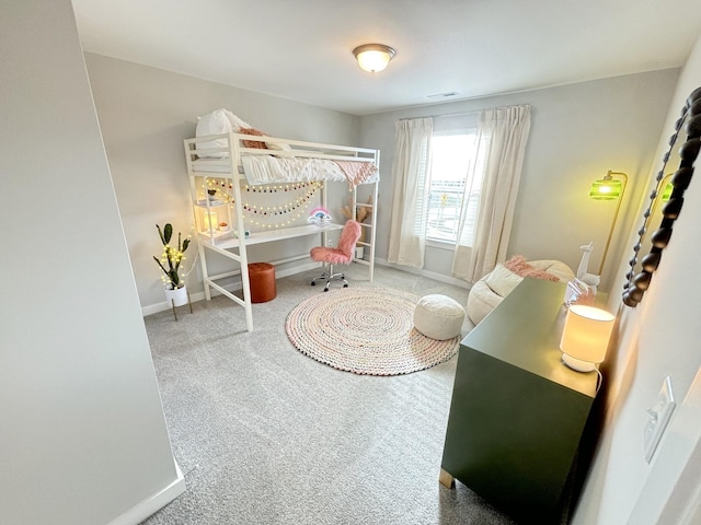 bedroom featuring carpet flooring and baseboards