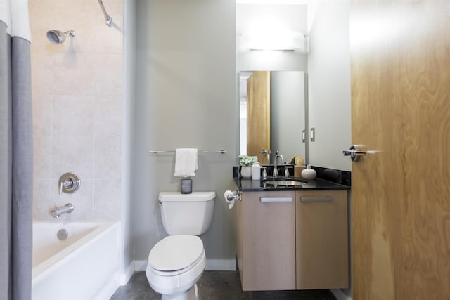 bathroom with baseboards, toilet, vanity, and bathtub / shower combination