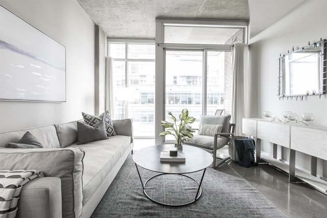 interior space featuring concrete floors and a wall of windows