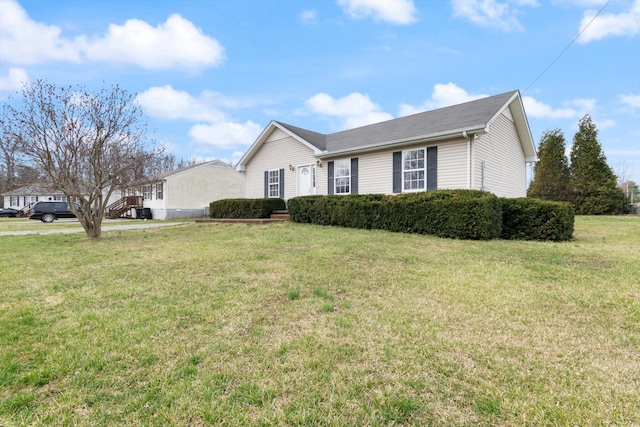 ranch-style house featuring a front yard