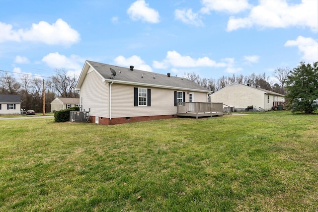 back of property with a wooden deck, a yard, central AC, and crawl space