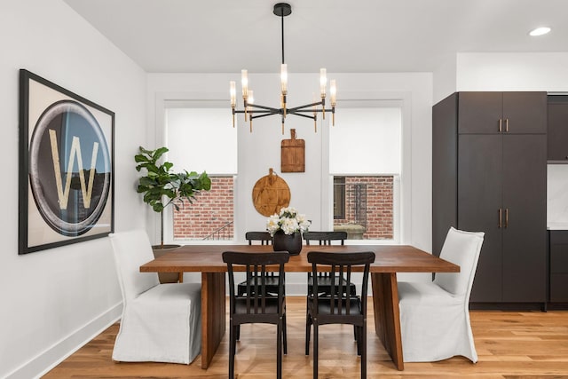 dining room with recessed lighting, light wood-style floors, baseboards, and a chandelier