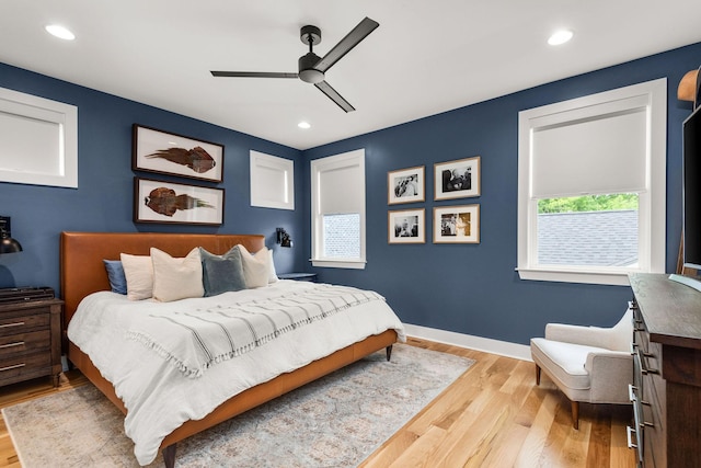 bedroom with recessed lighting, wood finished floors, baseboards, and ceiling fan