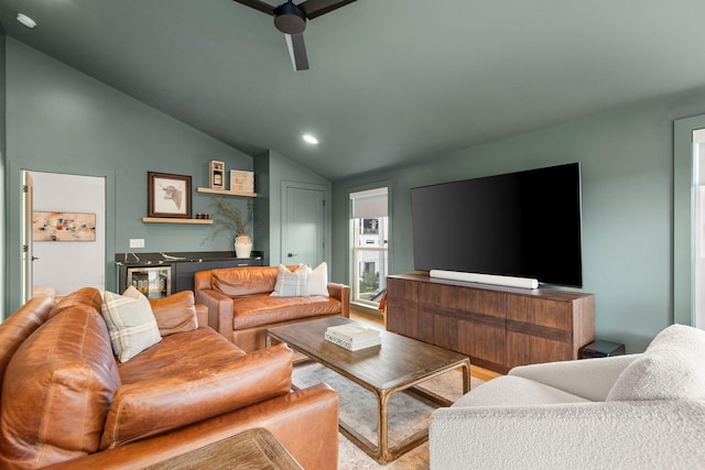 living room featuring vaulted ceiling, bar, recessed lighting, and a ceiling fan