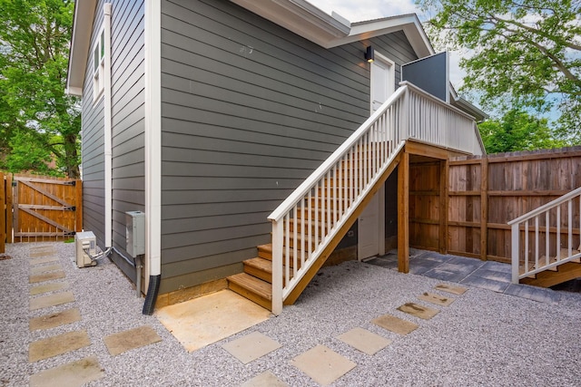 exterior space with a gate, stairway, a patio area, and fence