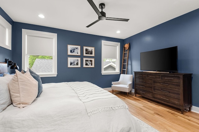 bedroom featuring recessed lighting, wood finished floors, baseboards, and ceiling fan