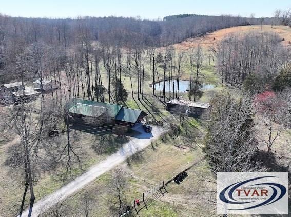 aerial view with a rural view and a view of trees