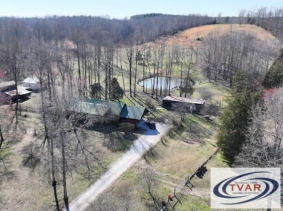 aerial view with a rural view and a view of trees