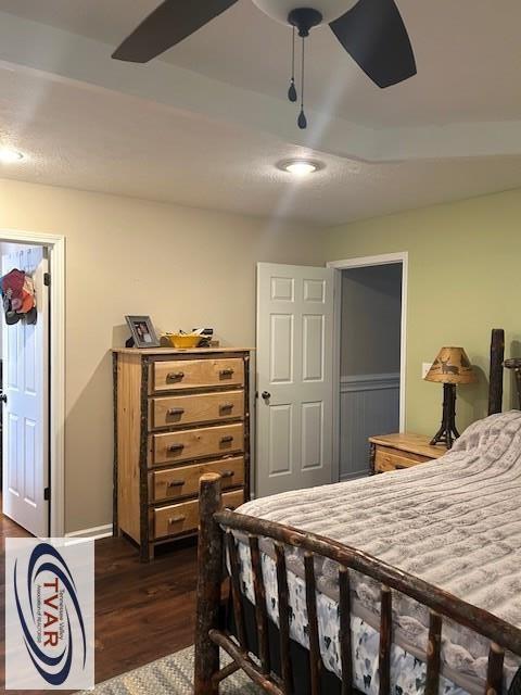 bedroom featuring dark wood-type flooring and a closet