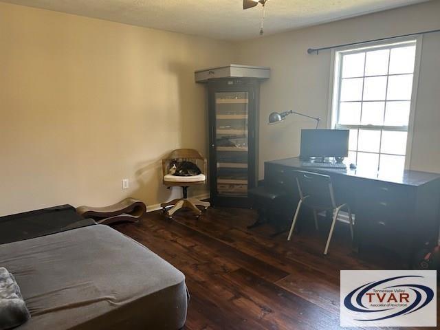 bedroom with wood finished floors