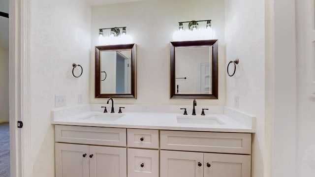 full bath featuring double vanity and a sink